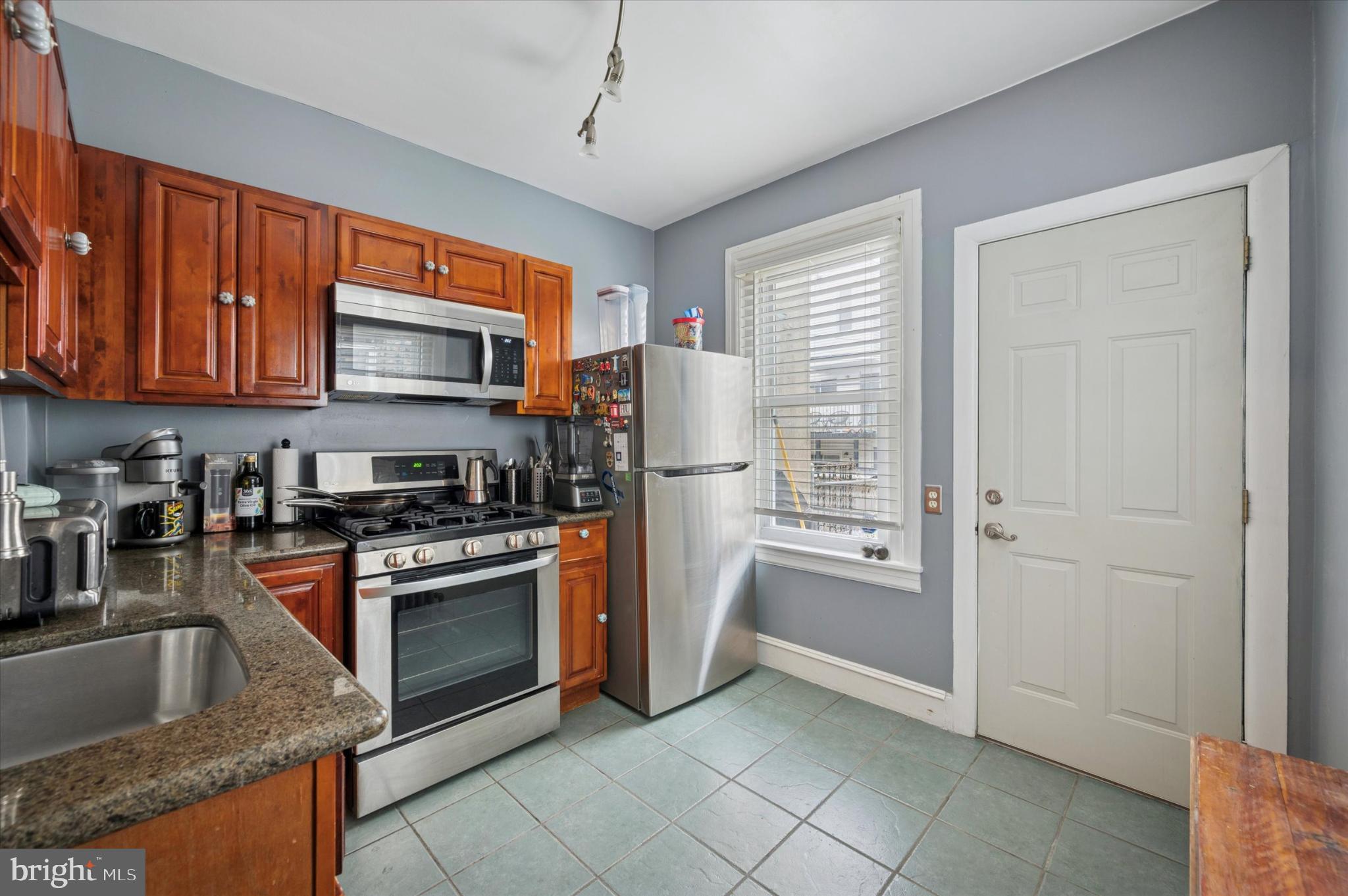 2423 South Millick Street Philadelphia, PA 19142 - Photo 12 of 15 Charming kitchen with modern appliances.