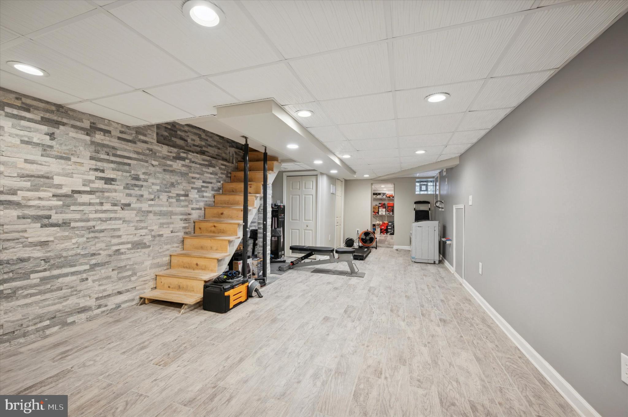 2423 South Millick Street Philadelphia, PA 19142 - Photo 4 of 15 Stylish basement gym with modern finishes.