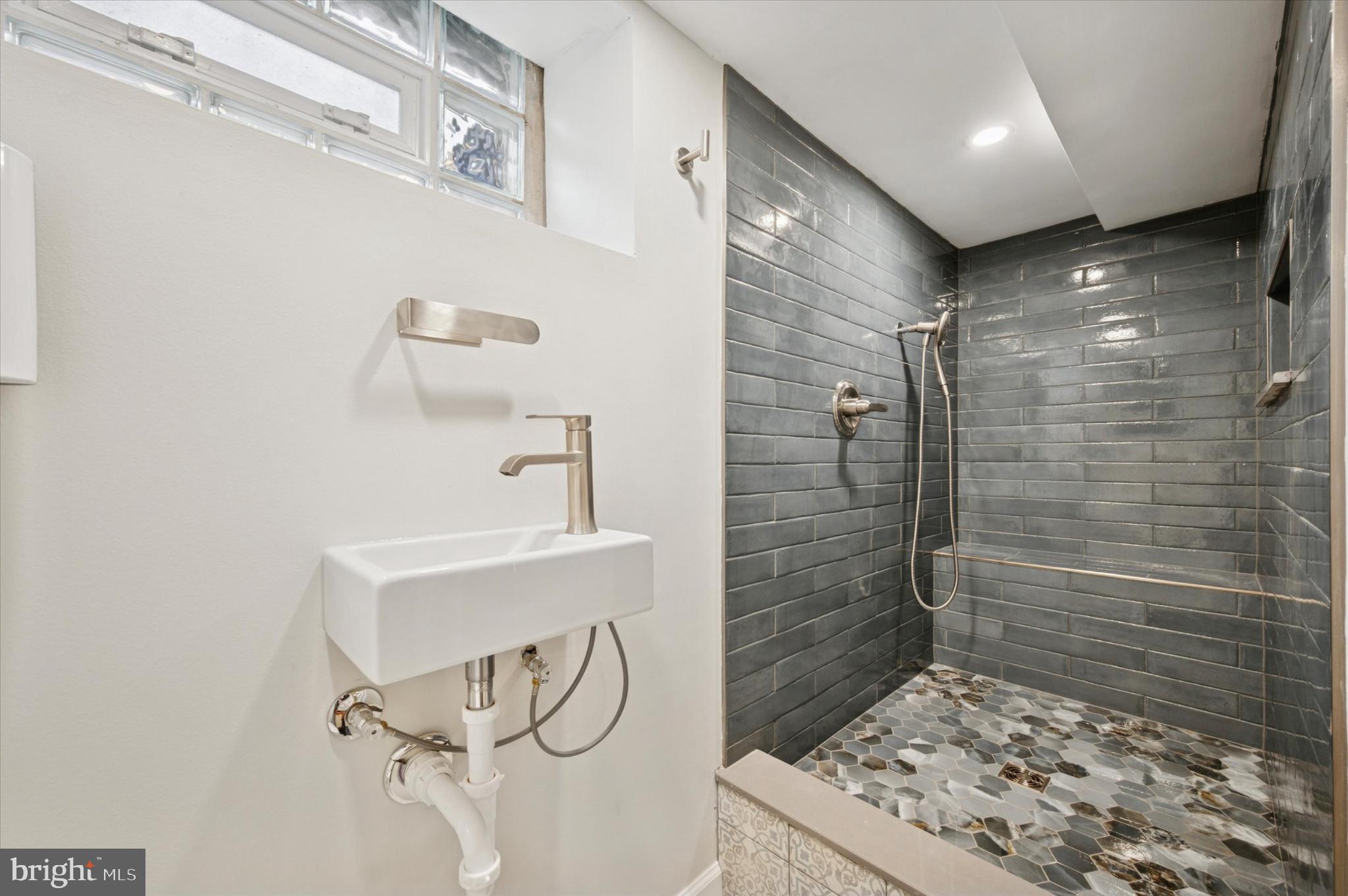 2423 South Millick Street Philadelphia, PA 19142 - Photo 5 of 15 Sleek modern bathroom with stylish finishes.