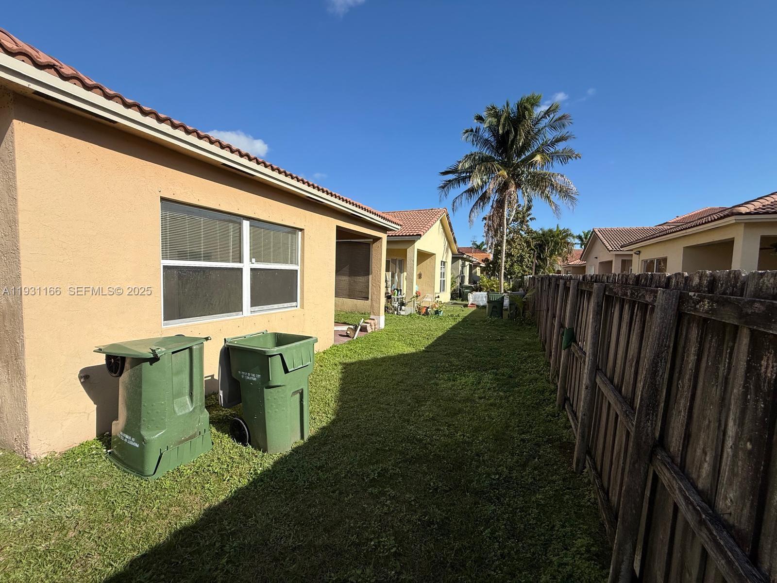 2221 Northeast 37th Terrace Homestead, FL 33033 - Photo 24 of 24 a house view with a garden space