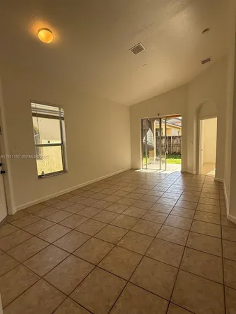 a view of an empty room and window
