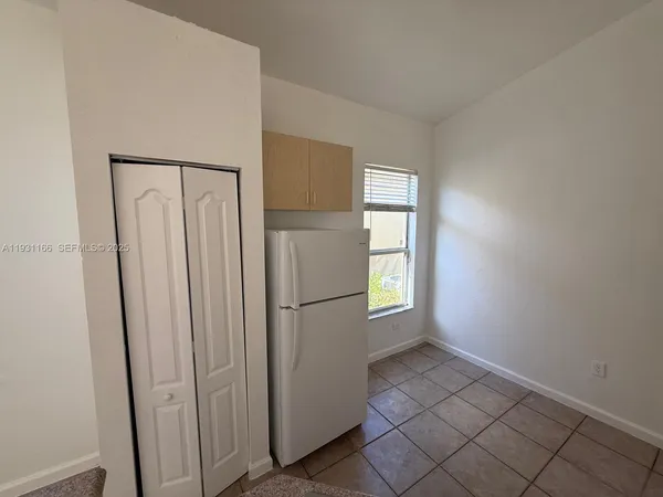 a kitchen with stainless steel appliances granite countertop a sink stove and microwave