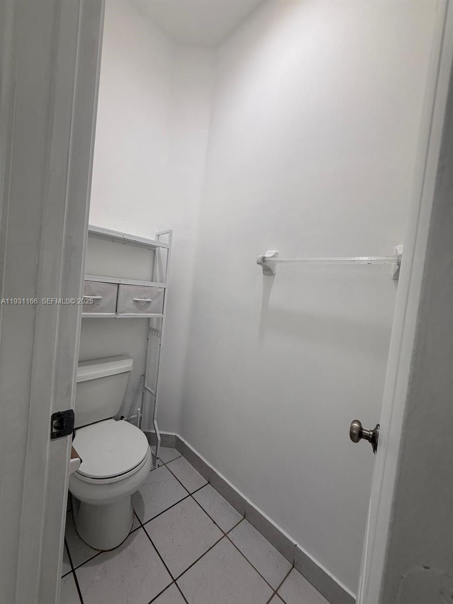2221 Northeast 37th Terrace Homestead, FL 33033 - Photo 9 of 24 a bathroom with a toilet