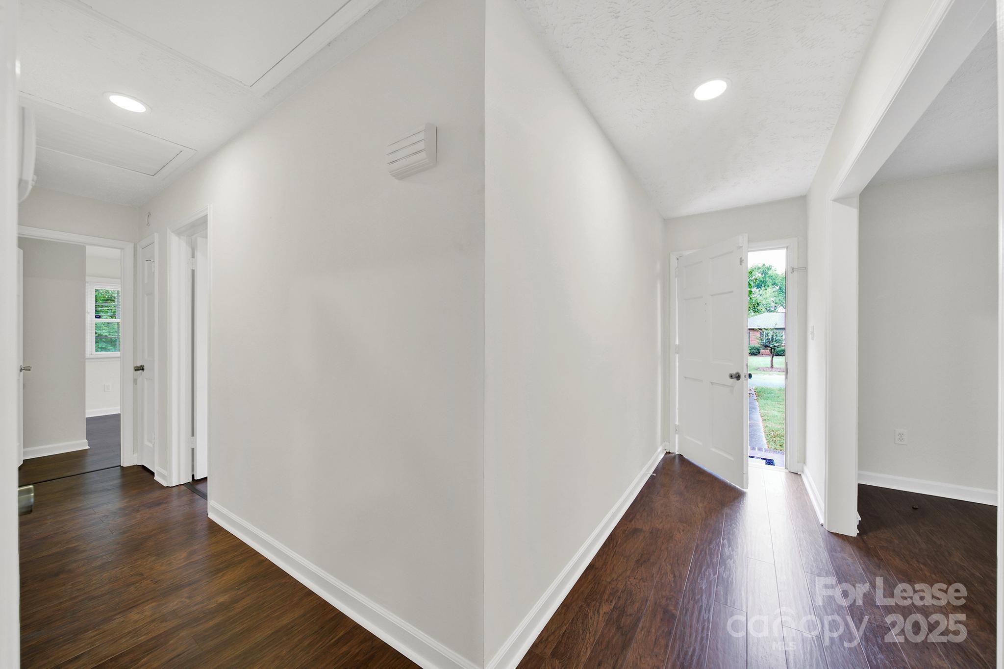 2400 Fox Hollow Road Mint Hill, NC 28227 - Photo 2 of 32 wooden floor in an empty room with a window