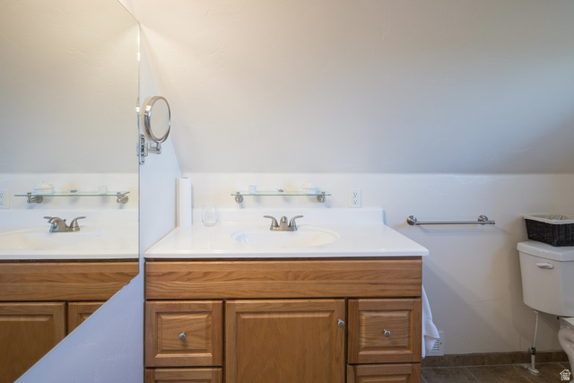 684 Blue Mountain Ridge Monticello, UT 84535 - Photo 51 of 71 Bathroom featuring vanity and lofted ceiling