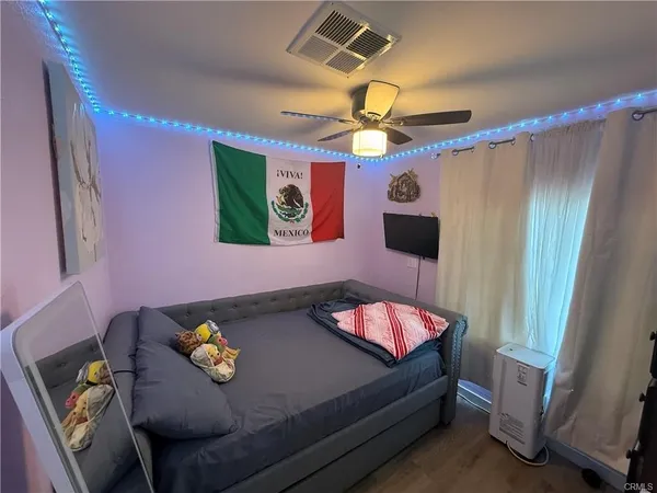 a bedroom with a bed and furniture