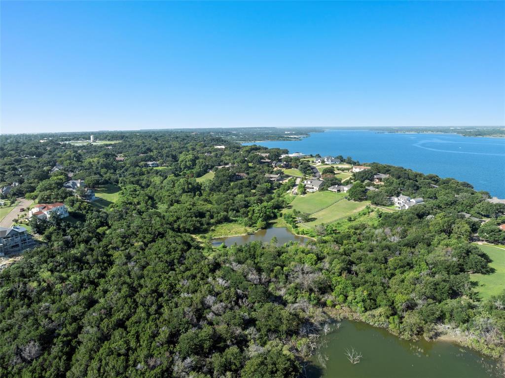 Tbd North Ridge Drive Waco, TX 76710 - Photo 6 of 10 Aerial overview of property's location featuring a nearby body of water and a heavily wooded area