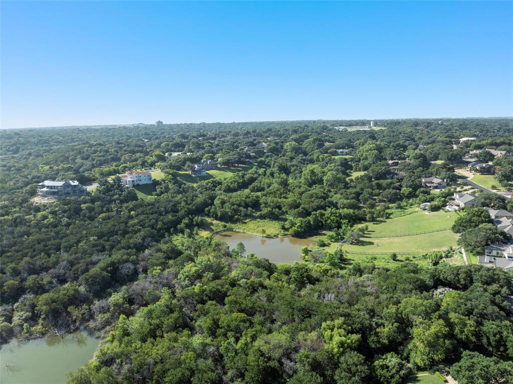 Tbd North Ridge Drive Waco, TX 76710 - Photo 7 of 10 Aerial view of property and surrounding area featuring a forest and a large body of water
