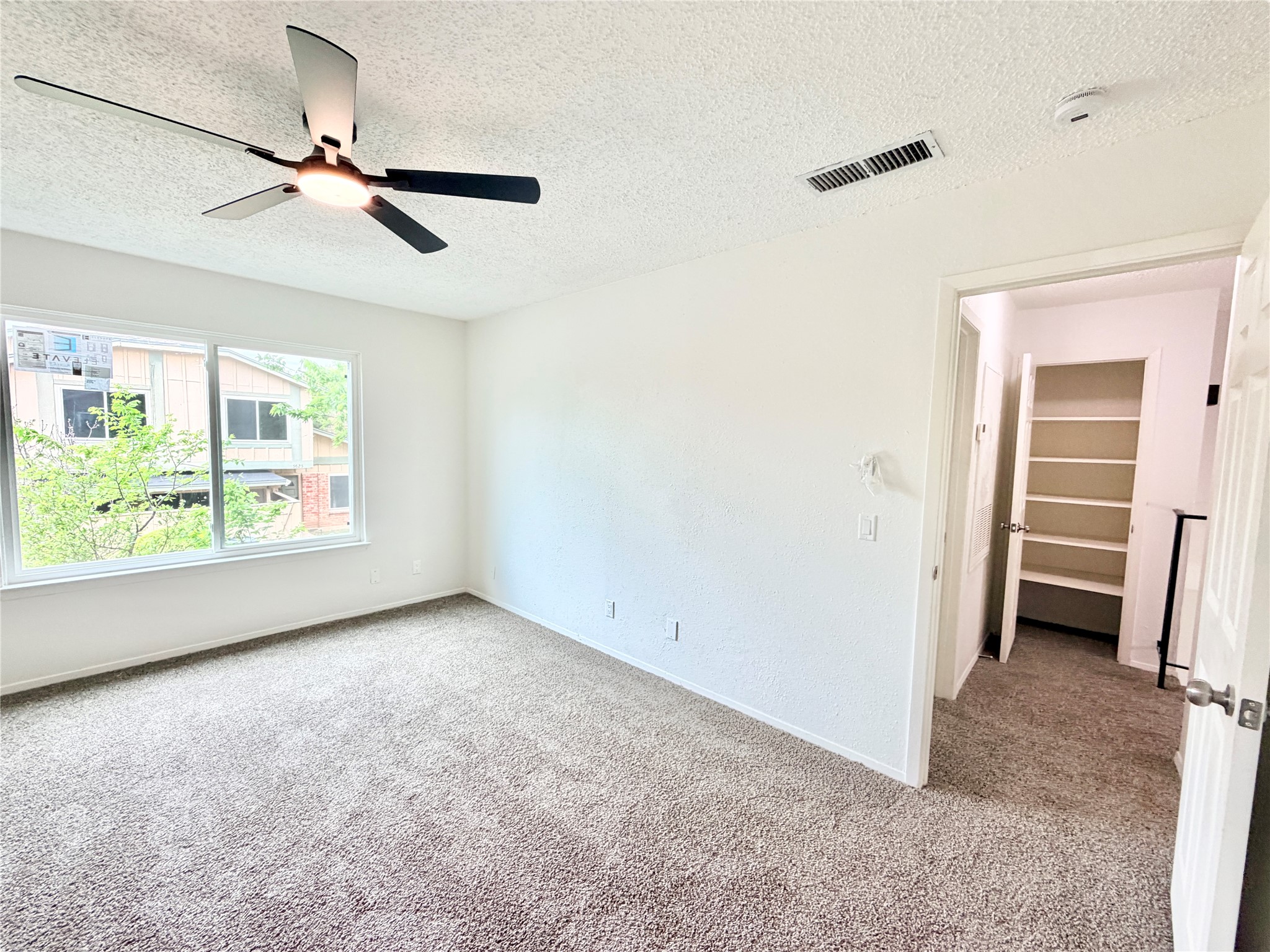 9623 Covey Ridge Lane Austin, TX 78758 - Photo 35 of 40 wooden floor in an empty room with a window