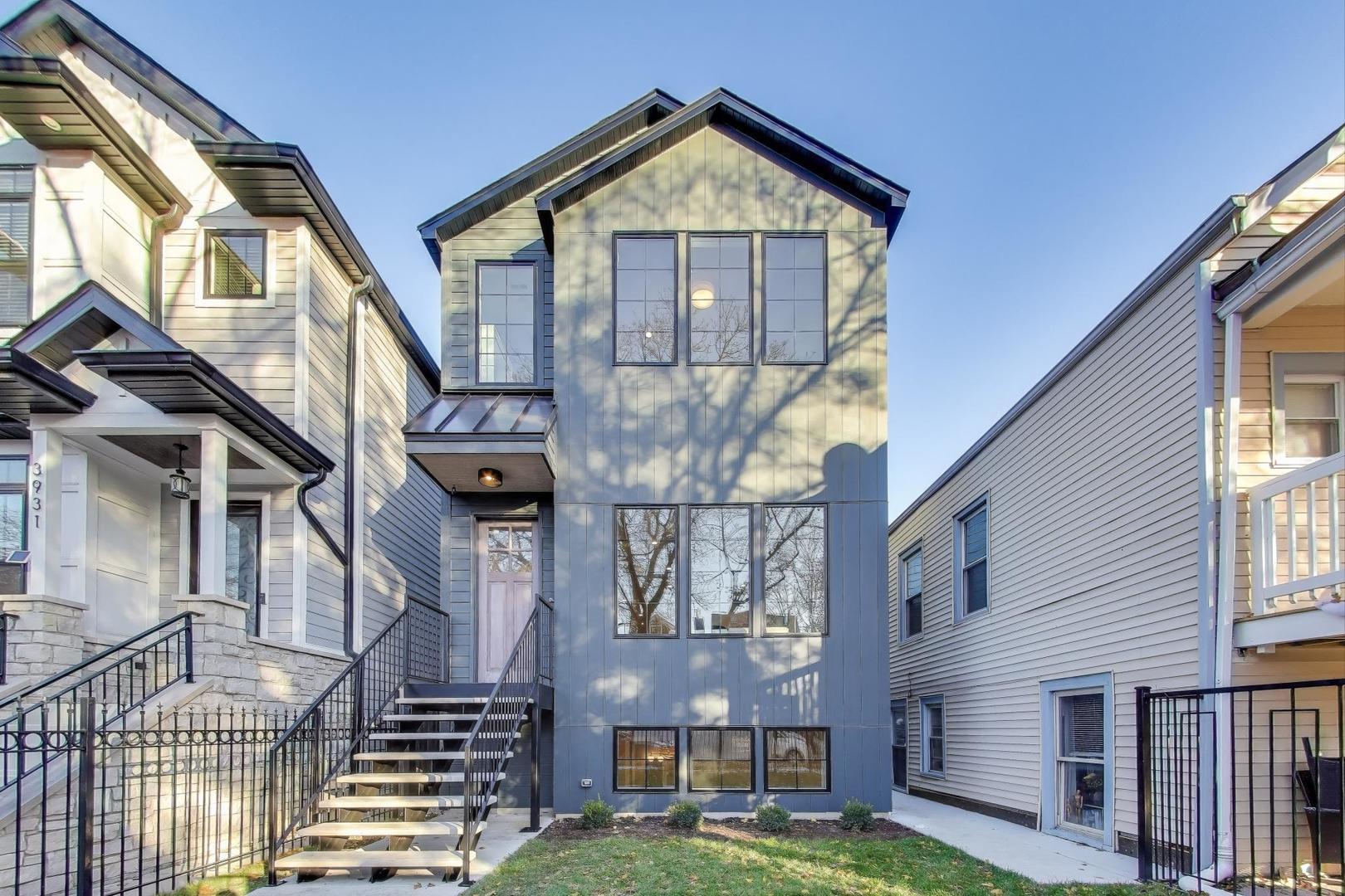 3929 North Francisco Avenue Chicago, IL 60618 - Photo 1 of 47 a front view of a house with a yard