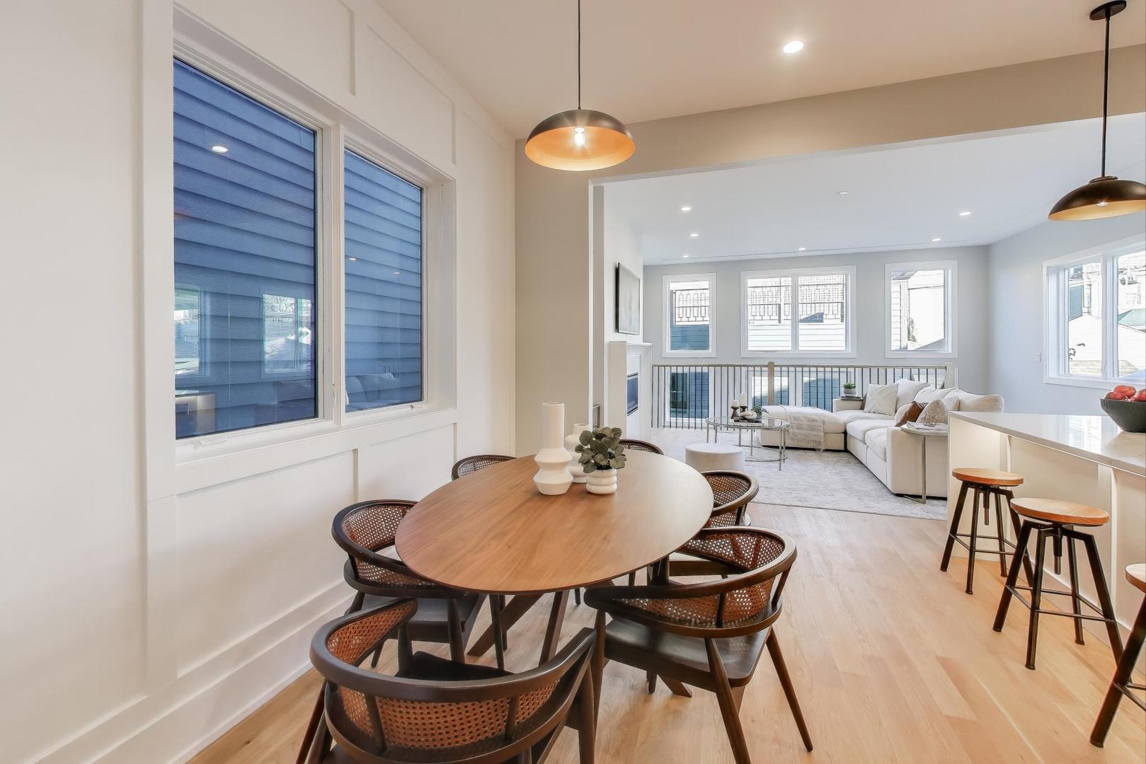 3929 North Francisco Avenue Chicago, IL 60618 - Photo 13 of 47 a kitchen with a dining table and chairs