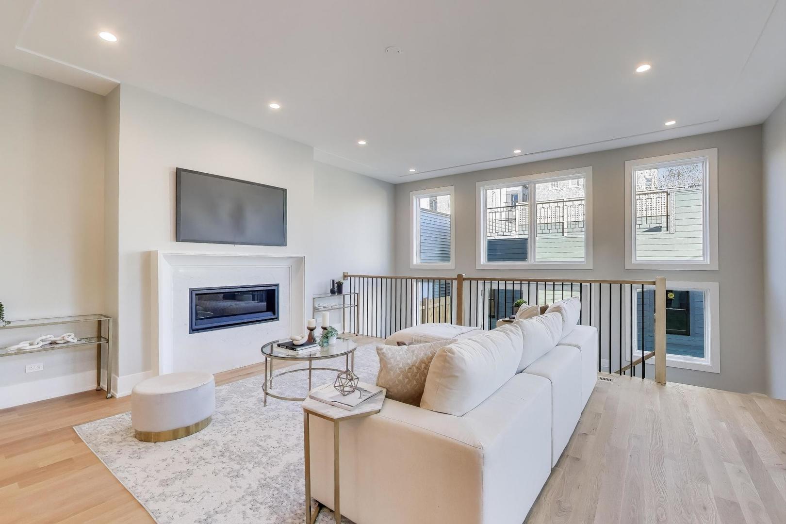 3929 North Francisco Avenue Chicago, IL 60618 - Photo 14 of 47 a living room with furniture and a fireplace