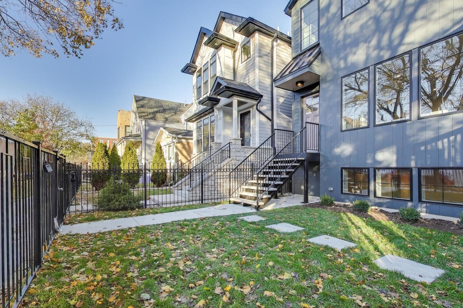 3929 North Francisco Avenue Chicago, IL 60618 - Photo 2 of 47 a view of a building with a yard