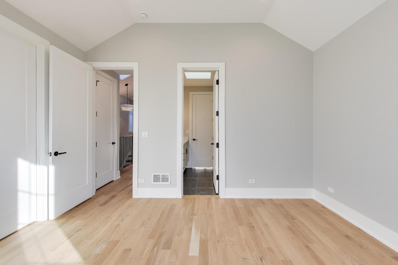 3929 North Francisco Avenue Chicago, IL 60618 - Photo 28 of 47 a view of an empty room with wooden floor