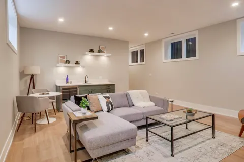 a living room with furniture and a table