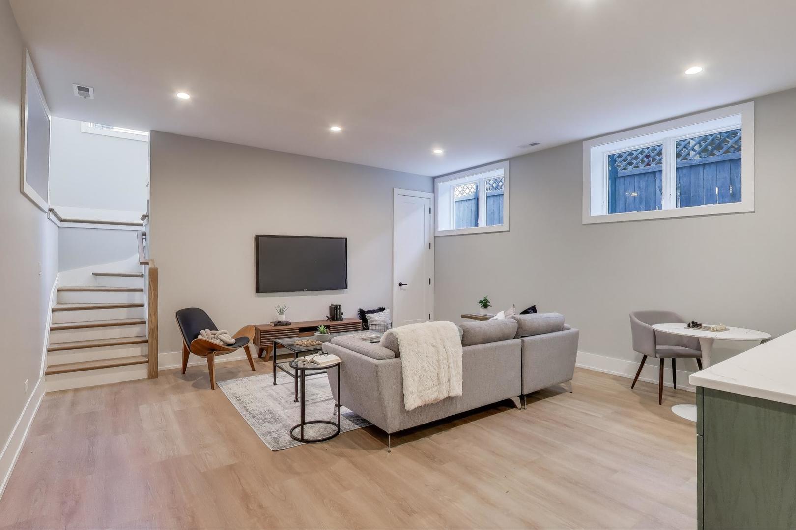 3929 North Francisco Avenue Chicago, IL 60618 - Photo 36 of 47 a living room with furniture and a wooden floor
