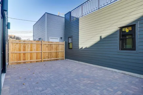a view of a house with a backyard