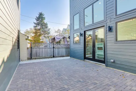a view of a porch with a wooden fence