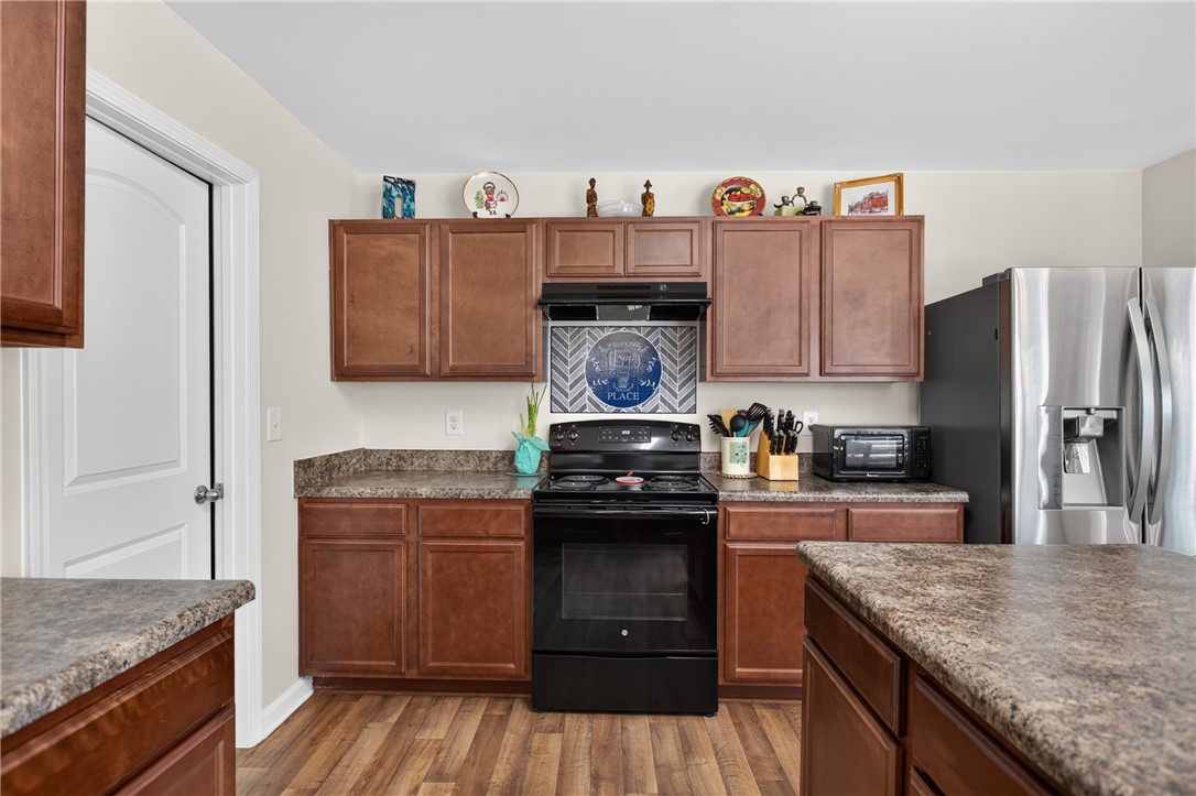 1081 Edenbrooke Circle Anderson, SC 29621 - Photo 13 of 46 Functional kitchen with ample cabinetry and robust countertops awaits culinary endeavors.