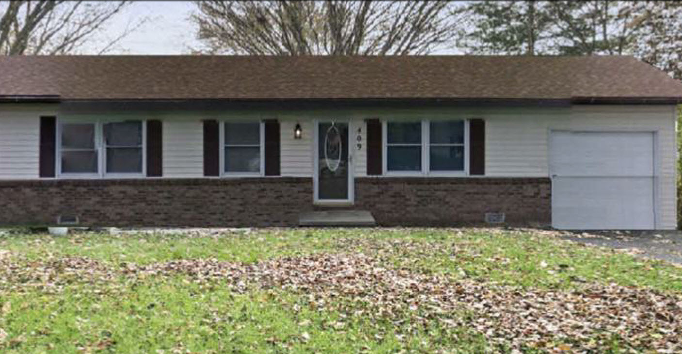 409 Lee Avenue Olney, IL 62450 - Photo 1 of 1 front view of a house with a yard