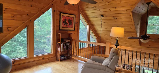 a view of a porch with furniture and a balcony