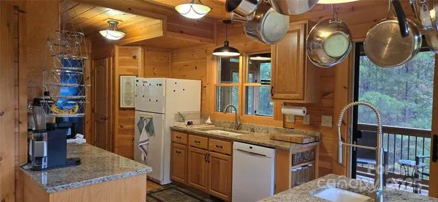 a kitchen with cabinets and stainless steel appliances