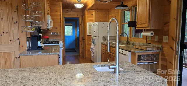 view of living room kitchen and utility room