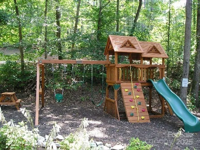 a view of a wooden deck with a yard