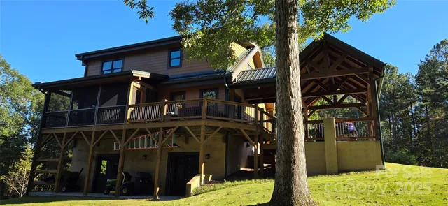 a view of a house with wooden fence