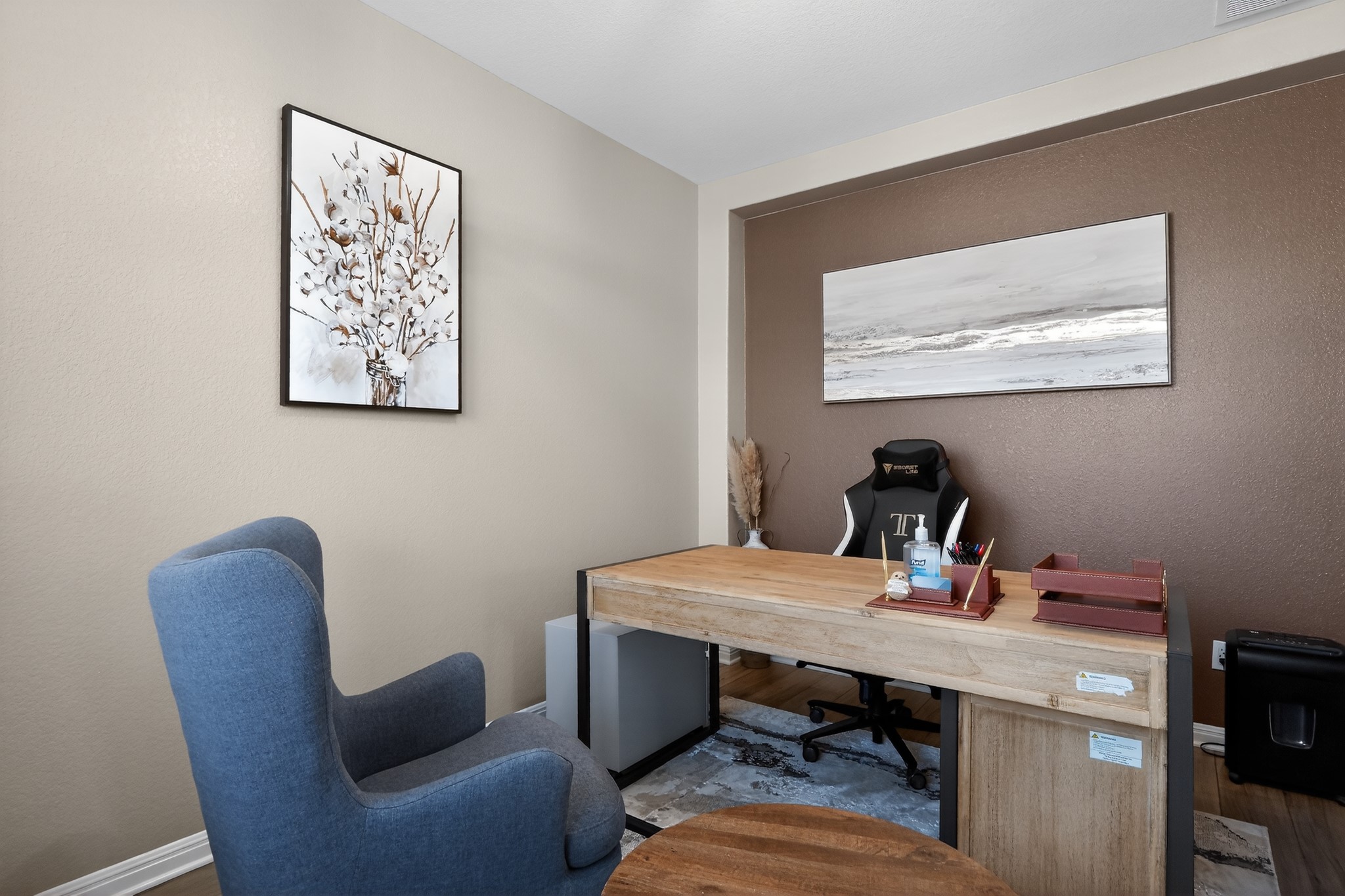 114 Bosco Road Hutto, TX 78634 - Photo 5 of 39 An inviting home office offers a comfortable seating area alongside a functional workspace.