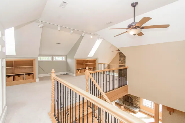 an aerial view of a house with a yard basket ball court and outdoor seating