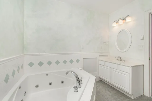 a view of a field with trees in the background