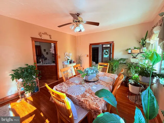 a kitchen with stainless steel appliances granite countertop a sink stove and wooden cabinets