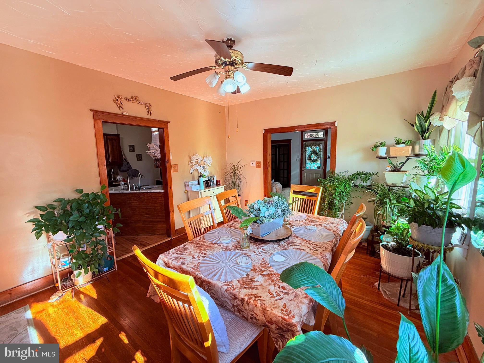 1200 Hampden Boulevard Reading, PA 19604 - Photo 12 of 32 a dining room with furniture a potted plant and a chandelier