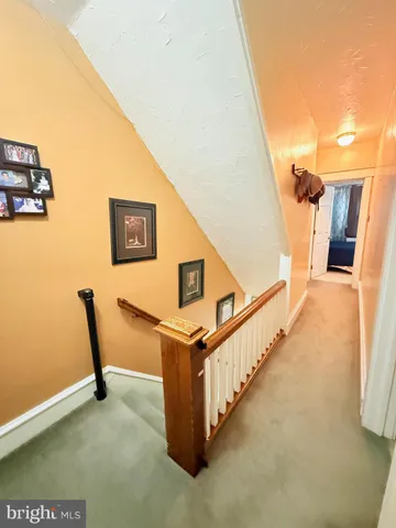 a view of a hallway with staircase