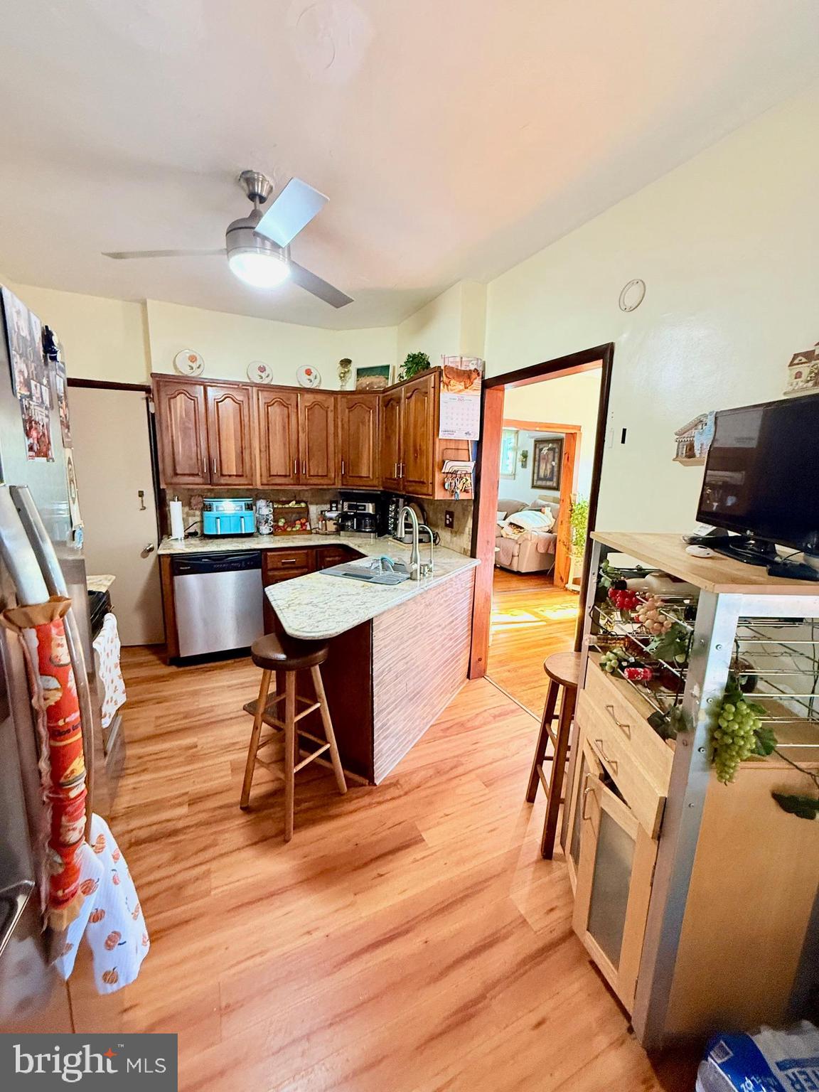 1200 Hampden Boulevard Reading, PA 19604 - Photo 14 of 32 a kitchen with a stove a refrigerator and wooden floor