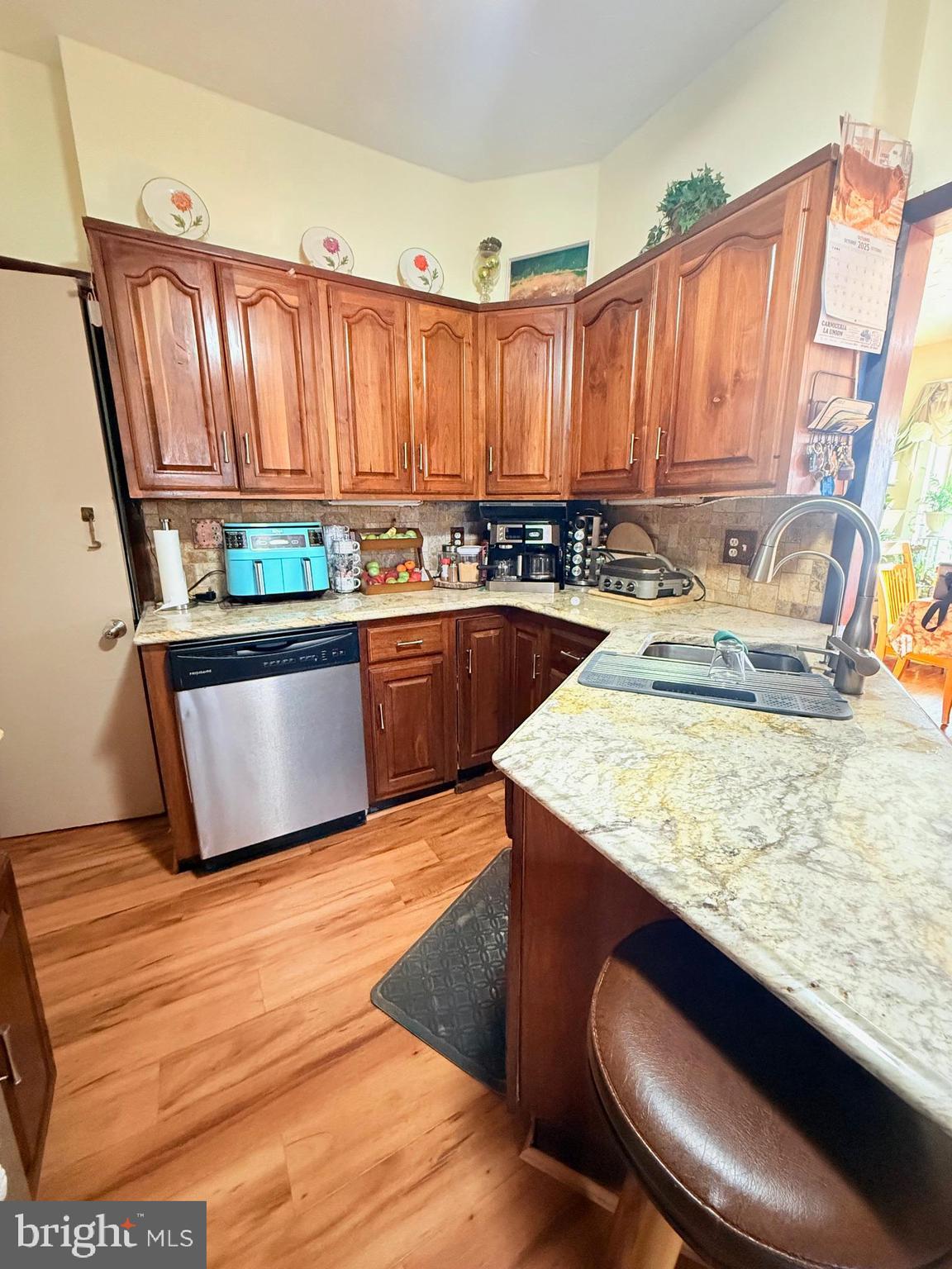 1200 Hampden Boulevard Reading, PA 19604 - Photo 15 of 32 a kitchen with stainless steel appliances granite countertop a sink and a wooden cabinets