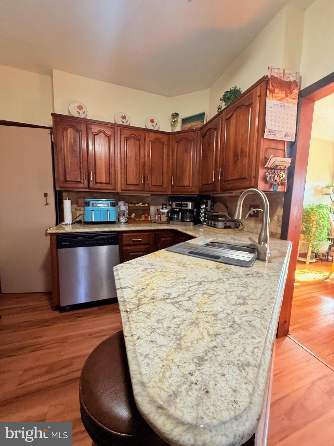 1200 Hampden Boulevard Reading, PA 19604 - Photo 16 of 32 a kitchen with wooden cabinets a sink and a stove