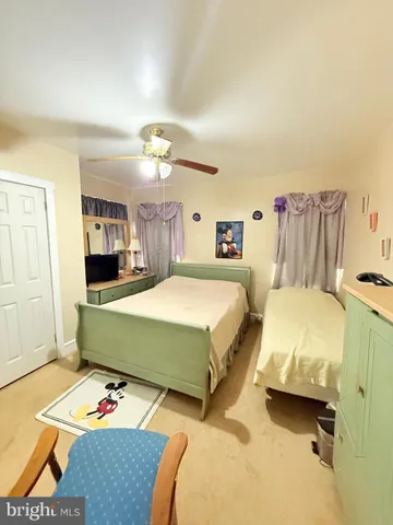 a bedroom that has a bed and a table in it