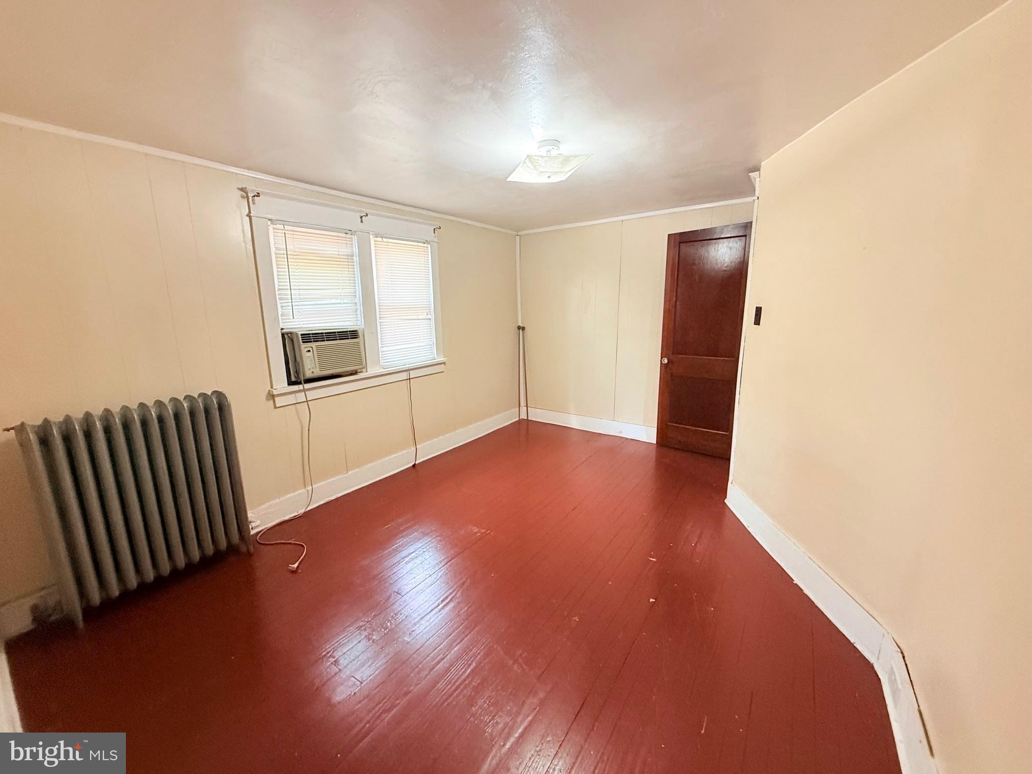 1200 Hampden Boulevard Reading, PA 19604 - Photo 21 of 30 an empty room with wooden floor and windows