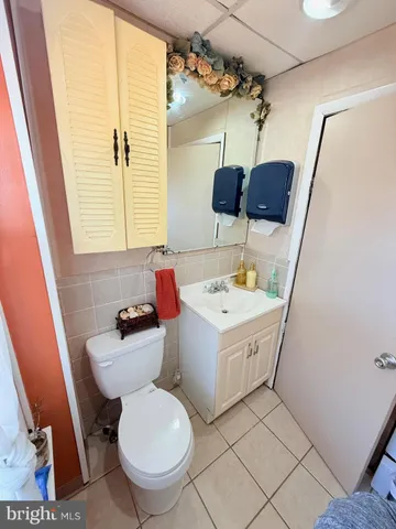 a bathroom with a sink toilet and vanity