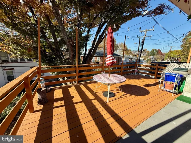 a view of sitting area with chairs and wooden floor