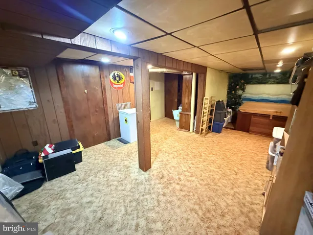 a view of sitting area with chairs and wooden floor