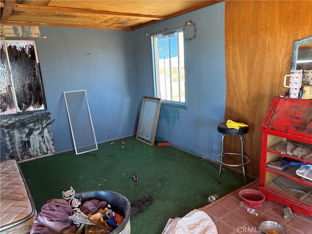 64815 Carot Road Joshua Tree, CA 92252 - Photo 6 of 11 a backyard of a house with seating space