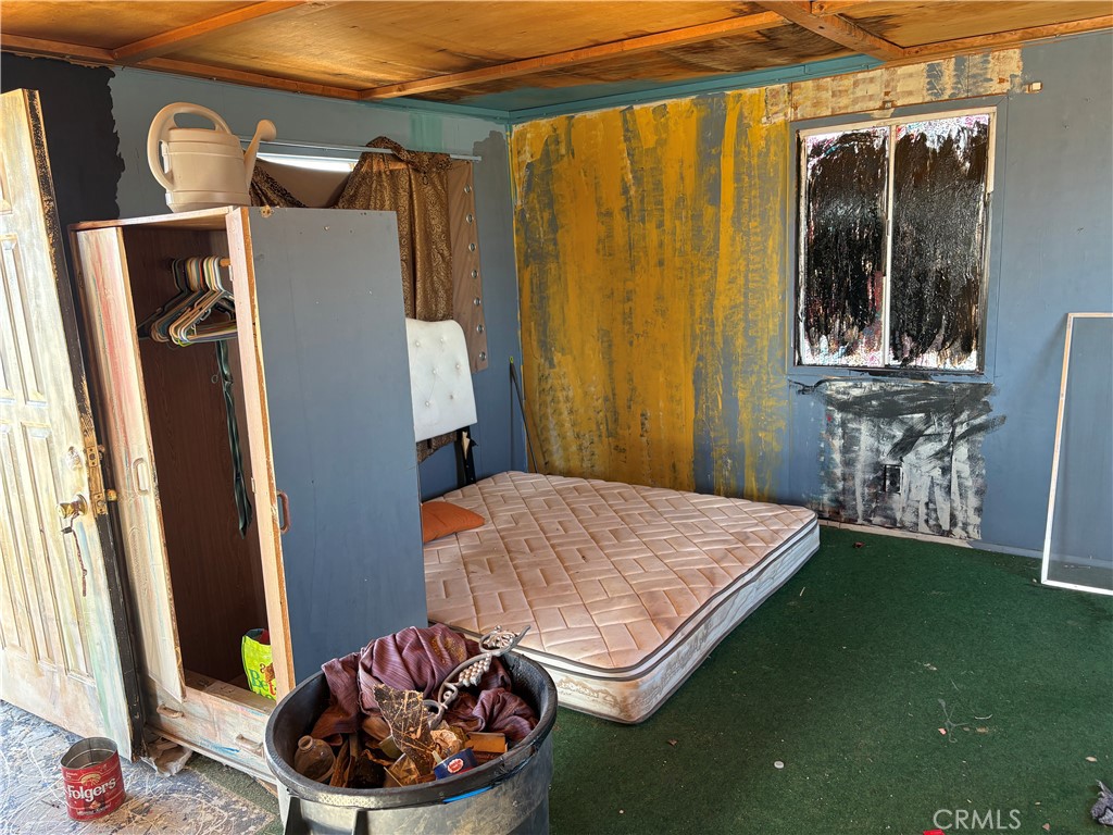 64815 Carot Road Joshua Tree, CA 92252 - Photo 7 of 11 a living room with furniture and a window