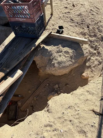 a view of living room with furniture and a fireplace