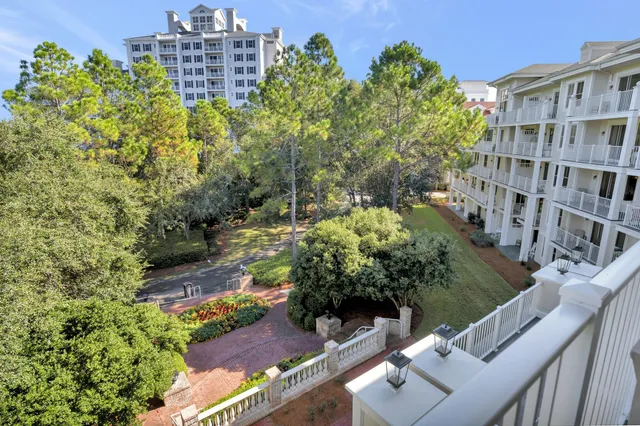 a view of a multi story building with yard