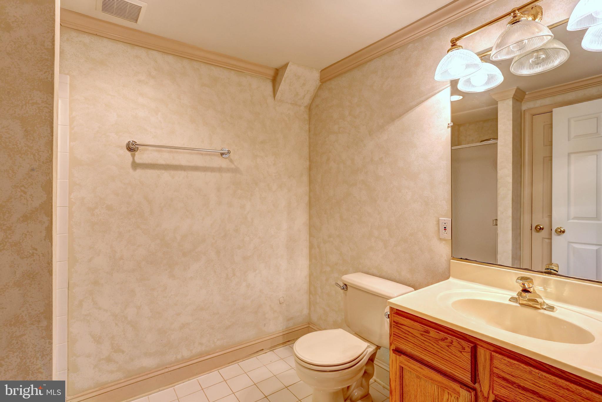 6136 Starburn Path Columbia, MD 21045 - Photo 19 of 35 a bathroom with a sink a toilet and shower