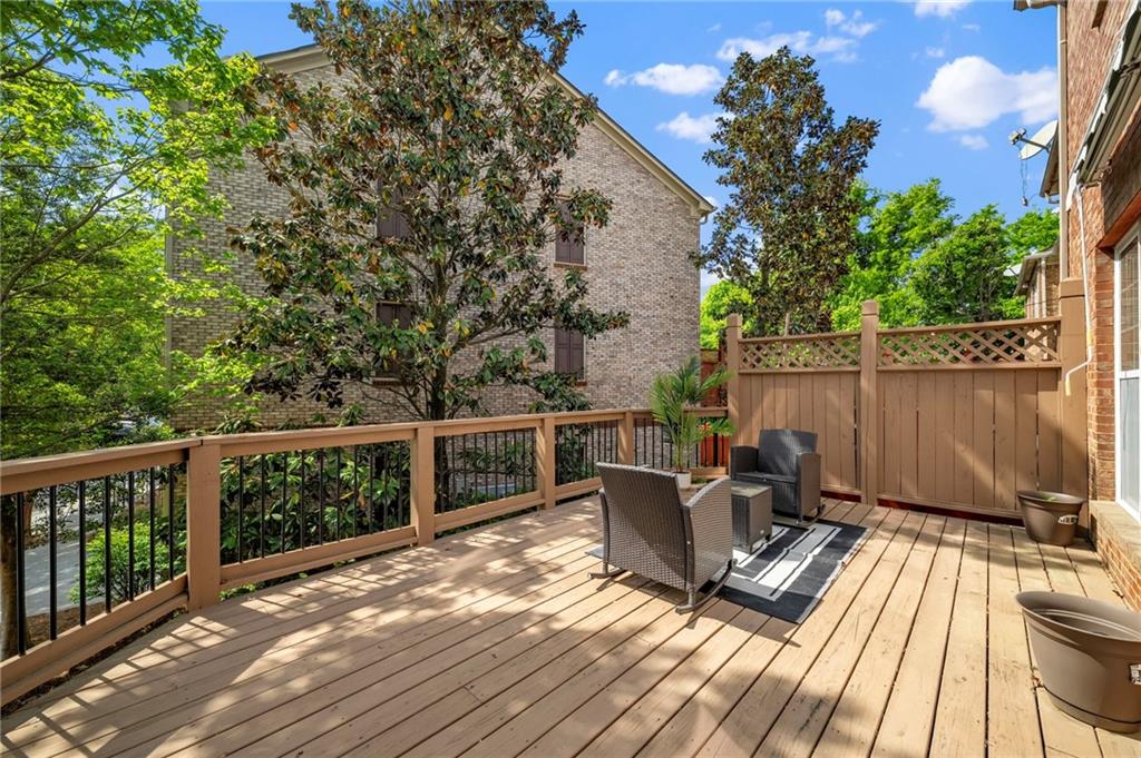 2872 Overlook Way Northeast Atlanta, GA 30324 - Photo 36 of 47 a view of a balcony with wooden floor and outdoor seating