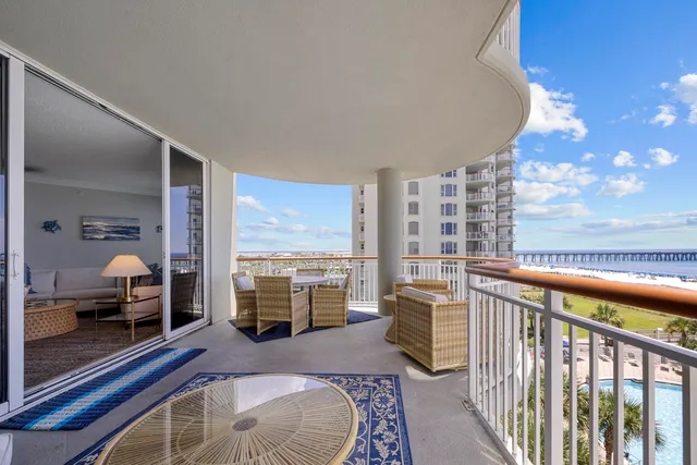 a bedroom with furniture and a large window